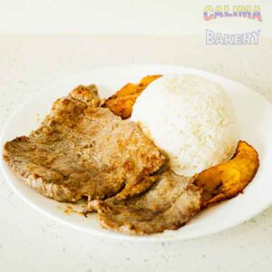 Carne asada con arroz y maduros. (Grilled Steak with rice and sweet plantains)